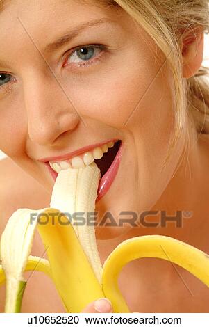 Close-up of Woman eating banana View Large Photo Image Stock Image - Close-up of Woman eating banana. Fotosearch