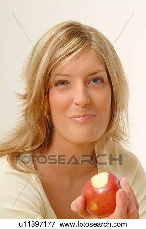 Portrait of Woman eating apple, chewing View Large Photo Image Stock Photo - Portrait of Woman eating apple, chewing. Fotosearch