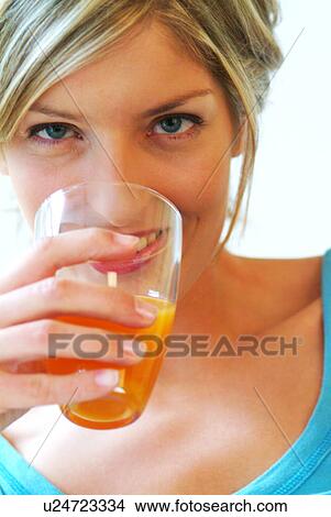 Close-up of Woman drinking orange juice View Large Photo Image Picture - Close-up of Woman drinking orange juice. Fotosearch