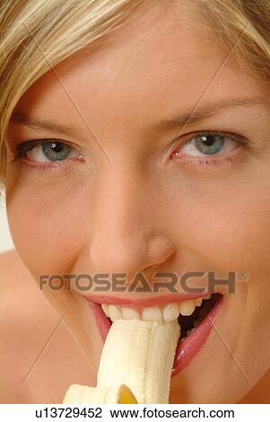 Close-up of Woman eating banana View Large Photo Image Stock Image - Close-up of Woman eating banana. Fotosearch