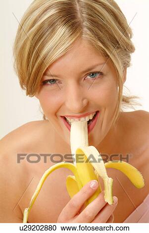 Portrait of Woman eating banana View Large Photo Image Stock Image - Portrait of Woman eating banana. Fotosearch