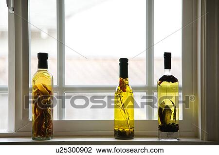 Stock Image - Bottle of Cooking Oil on Windowsill. Fotosearch