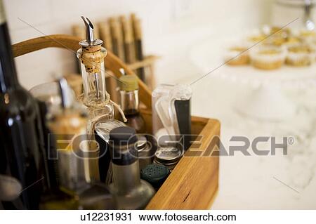 Stock Image - Cooking Oils and Spices in Wood Tray. Fotosearch