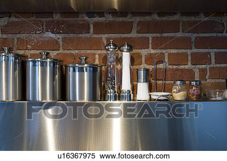 Stock Photography - Detail of cooking spices on stainless steel shelf.. Fotosearch