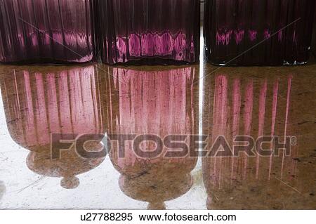 Stock Photography - Detail of Purple Glass Cannisters. Fotosearch