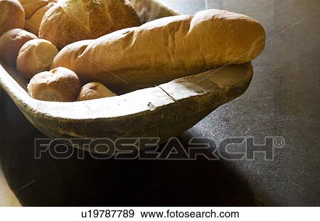 Stock Photo - Fresh Baked Bread in Wood bowl. Fotosearch