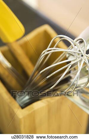 Stock Photo - Kitchen cooking utensils in wood container. Fotosearch