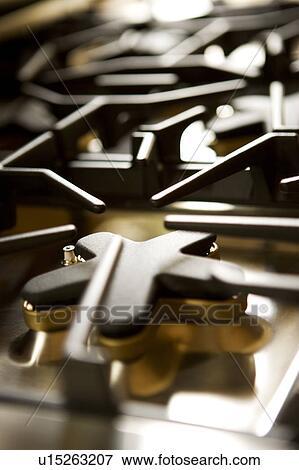 Stock Photo - Stainless steel gas stovetop. Fotosearch