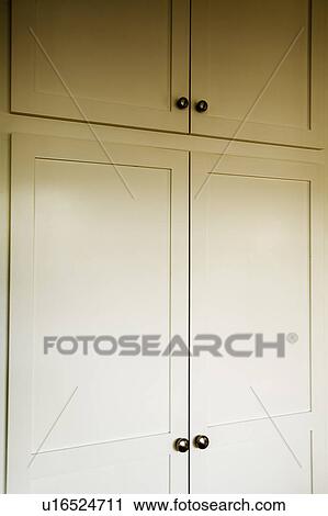 Stock Image - Traditional White Cupboards/Pantry. Fotosearch