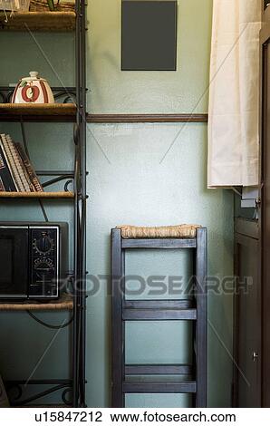 Vignette of kitchen wall unit and stool. View Large Photo Image Stock Image - Vignette of kitchen wall unit and stool.. Fotosearch