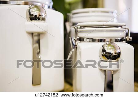 White Ceramic Containers and Silver Spoons View Large Photo Image Stock Image - White Ceramic Containers and Silver Spoons. Fotosearch
