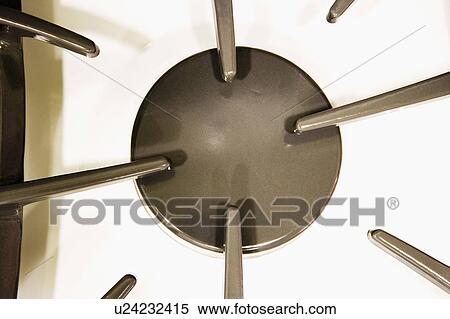 Stock Photography - White stovetop and grey burner. Fotosearch