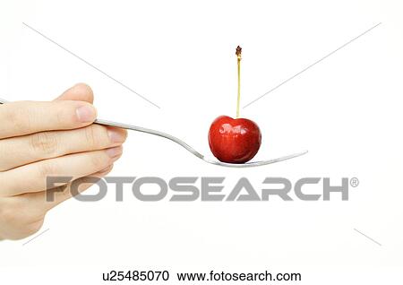 Stock Image - Cherry on fork. Fotosearch
