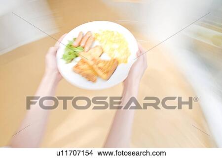 Plate with food being carried View Large Photo Image Picture - Plate with food being carried. Fotosearch