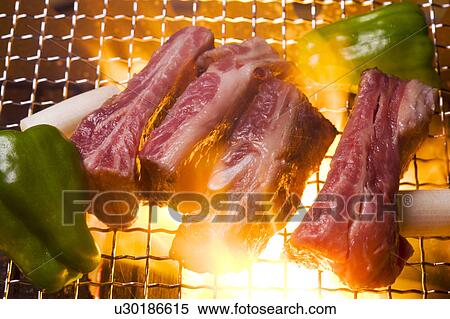 Ribs on grill with green peppers View Large Photo Image Stock Photography - Ribs on grill with green peppers. Fotosearch