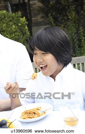 Boy eating pasta View Large Photo Image Stock Photograph - Boy eating pasta. Fotosearch