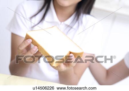 Hand having bread View Large Photo Image Stock Photograph - Hand having bread. Fotosearch