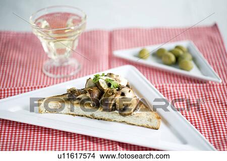 Picture - Open sandwich of a brown mushroom. Fotosearch