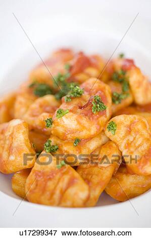 Stock Photo - Tomato source gnocchi. Fotosearch