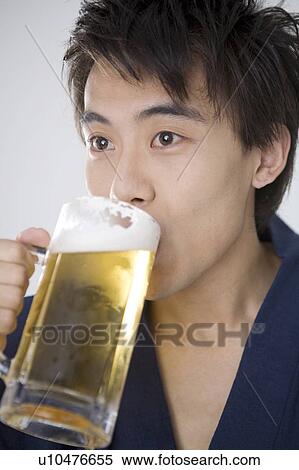 Stock Photography - Man who drinks beer. Fotosearch