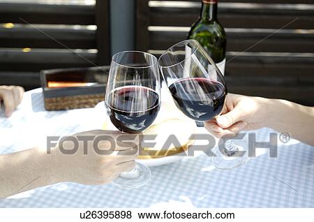 Stock Photo - Toasting with the wine. Fotosearch