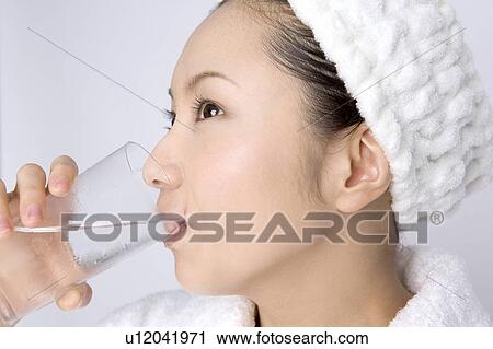 Woman drinking a water View Large Photo Image Stock Image - Woman drinking a water. Fotosearch