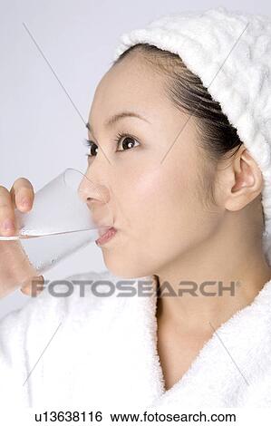 Woman drinking a water View Large Photo Image Stock Photograph - Woman drinking a water. Fotosearch