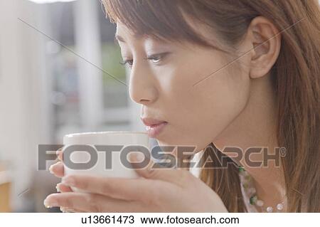 Woman who drinks coffee View Large Photo Image Stock Image - Woman who drinks coffee. Fotosearch
