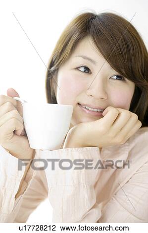 Stock Image - Woman who drinks coffee. Fotosearch