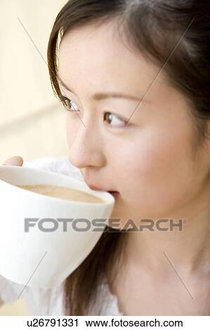 Woman who drinks coffee View Large Photo Image Stock Image - Woman who drinks coffee. Fotosearch
