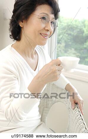 Stock Photo - Woman who drinks tea. Fotosearch