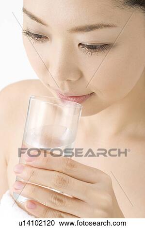 Stock Image - Woman who drinks water. Fotosearch