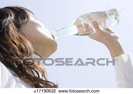 Stock Image - Woman who drinks water. Fotosearch