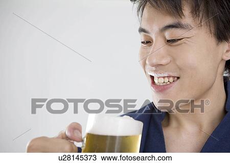 Yukata man who drinks beer View Large Photo Image Stock Image - Yukata man who drinks beer. Fotosearch