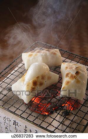 Grilled rice cakes over charcoal fire View Large Photo Image Stock Image - Grilled rice cakes over charcoal fire. Fotosearch