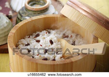 Stock Image - Steamed rice in a bamboo tub, close-up. Fotosearch