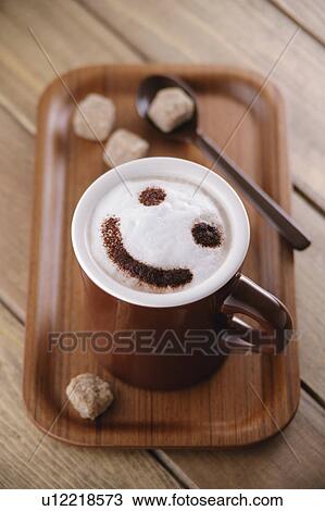 Stock Image - A cup of cappuccino with smiley face. Fotosearch