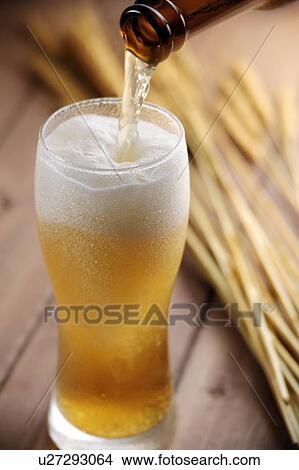 Beer pouring into glass View Large Photo Image Picture - Beer pouring into glass. Fotosearch