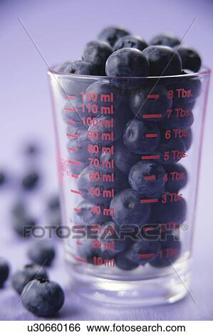 Stock Photograph - Blueberries in glass jar. Fotosearch