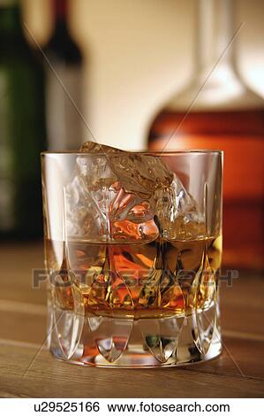 Stock Photograph - Glasses of whiskey. Fotosearch