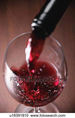 Red wine pouring into wineglass View Large Photo Image Stock Image - Red wine pouring into wineglass. Fotosearch