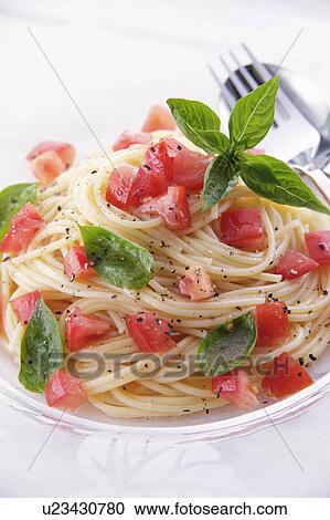 Cold spaghetti with tomatoes View Large Photo Image Stock Image - Cold spaghetti with tomatoes. Fotosearch