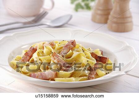 Spaghetti with carbonara sauce View Large Photo Image Stock Photo - Spaghetti with carbonara sauce. Fotosearch