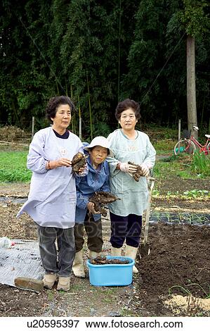 Farmers standing View Large Photo Image Stock Photo - Farmers standing. Fotosearch