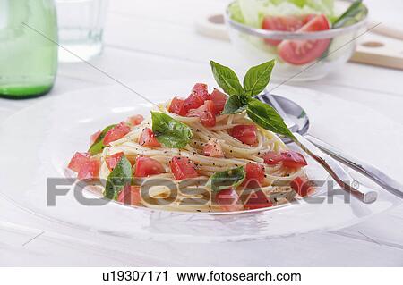 Cold spaghetti with tomatoes View Large Photo Image Stock Image - Cold spaghetti with tomatoes. Fotosearch