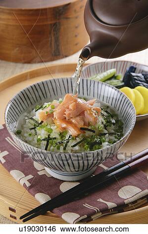 Bowl of rice with green tea View Large Photo Image Stock Photograph - Bowl of rice with green tea. Fotosearch