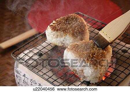 Grilled rice balls over charcoal fire View Large Photo Image Stock Photograph - Grilled rice balls over charcoal fire. Fotosearch