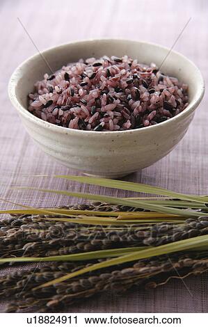 Stock Image - Steamed black rice. Fotosearch