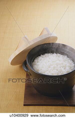 Stock Photo - Steamed rice in a steamer. Fotosearch