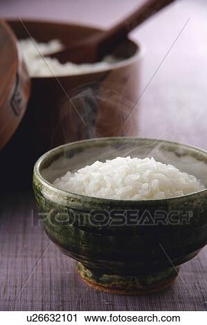 Stock Image - Steamed rice in rice bowl. Fotosearch